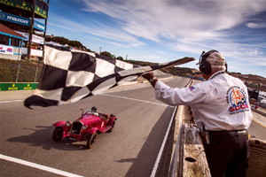 1933 Alfa Romeo 6C 1750 taking the chequered flag in race 1A at Laguna Seca Monterey Motorsports Reunion 2015